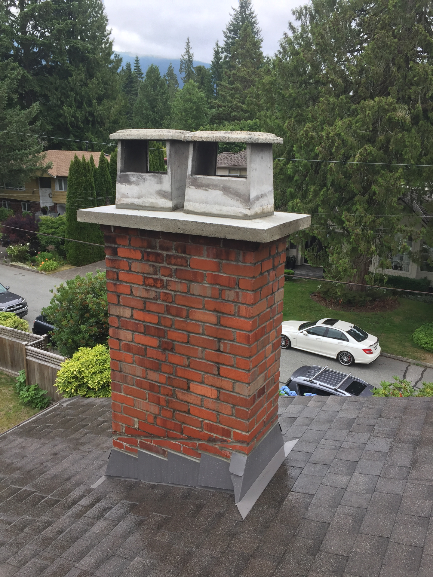 Dunbar project: brick chimney with a concrete crown and chimney pots